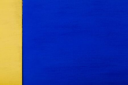 yellow blue painted wall texture backgroundの写真素材