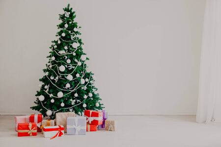 Christmas tree with presents in winter for the new yearの写真素材