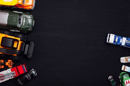 lots of childrens toy cars for playing boy on a blackの写真素材