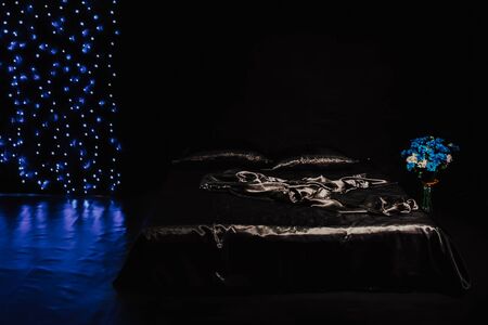 the interior of the black bedroom at night bed bedroomの写真素材