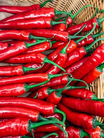 ripe spicy red chilli peppers for eating like a backgroundの写真素材