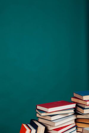 many stacks of educational books to prepare for exams in the university libraryの写真素材