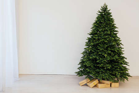 Christmas tree with gifts new year decor white backgroundの写真素材