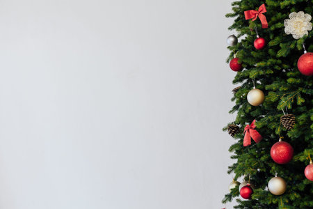 Green Christmas tree with red gifts for new year holiday decor