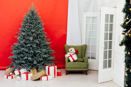 Blue Christmas tree with gift decor for the new year winter in the white postcard room holiday red...