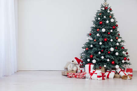 Blue Christmas tree with gifts decor for the new year winter in the roomの写真素材