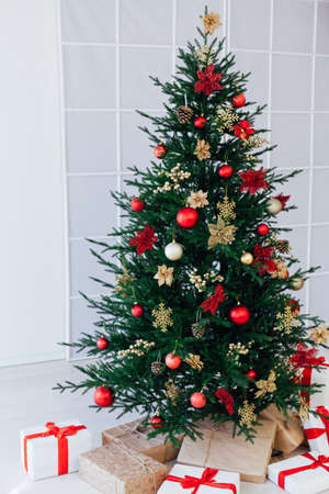 Christmas tree pine with gifts for the new year interior postcard bannerの写真素材