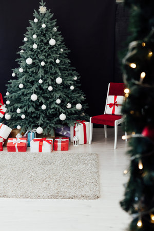 Christmas tree pine New Years decor interior room with gifts black background