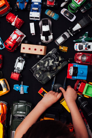 lots of baby toy cars for developing boy games in the background