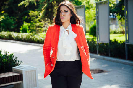 Beautiful fashionable oriental brunette woman in business business suitの写真素材