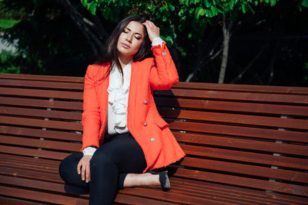 Beautiful fashionable oriental brunette woman in business business suitの写真素材