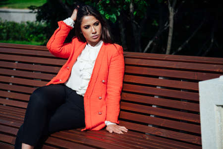 Beautiful fashionable oriental brunette woman in business business suitの写真素材