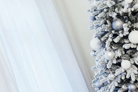 White snowy Christmas tree decor home New Year postcardの写真素材
