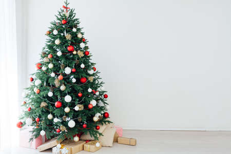 Decorated room with beautiful Christmas tree and giftsの写真素材