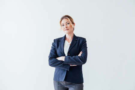 beautiful business woman in business suit at work in the office with documentsの写真素材