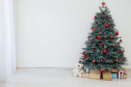 Christmas tree blue pine with gifts interior new year December postcardの写真素材