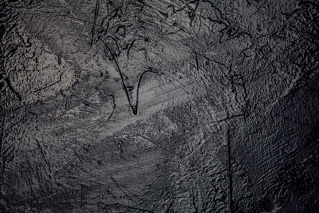 painted black-painted textured wall texture background structureの写真素材