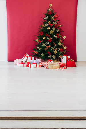 Christmas tree with new year gifts holiday red decorations