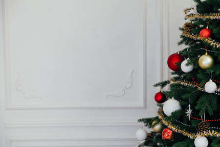 Christmas tree pine interior of the house new year decoration garland giftsの写真素材