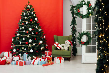 Christmas tree pine red interior house new year decor garland gifts postcardの写真素材