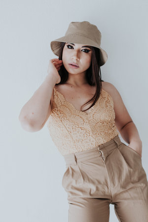 beautiful fashion business brunette woman in beige clothes