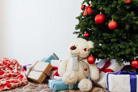 Christmas tree new year decor presents white background place for inscriptionの写真素材