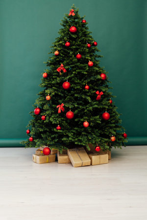 Beautiful holdiay decorated room with Christmas tree with presents under it