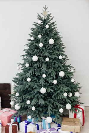 New year bedroom decor with Christmas tree bed with gifts and garlands interior