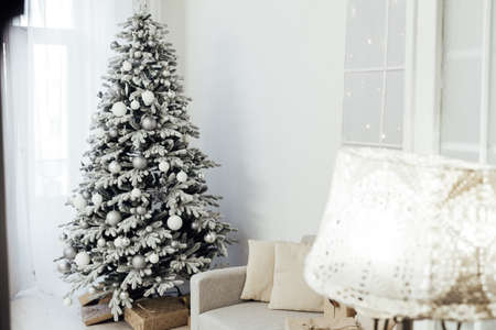 room decorated for the Christmas holidays new year tree giftsの写真素材