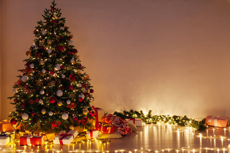 Lights garland decor Christmas tree holiday gifts new year backgroundの写真素材