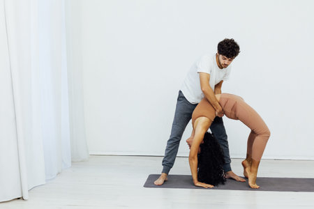 Male and female paired yoga asana gymnastics fitness