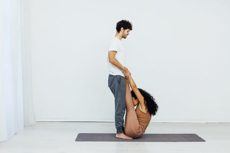 Male and female paired yoga asana gymnastics fitness