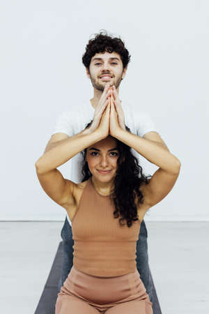Male and female doubles yoga asana gymnastics fitnessの写真素材