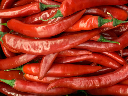 lots of ripe red chilli peppers for eating as a background