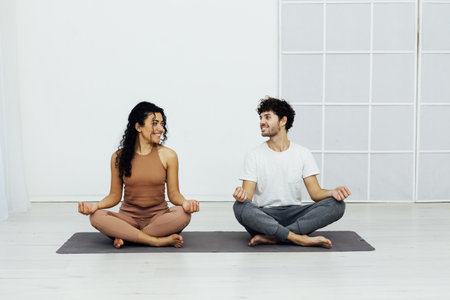 Male and female doubles yoga asana gymnastics fitnessの写真素材