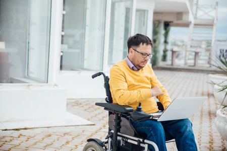 man with disabilities in wheelchair job business onlineの写真素材