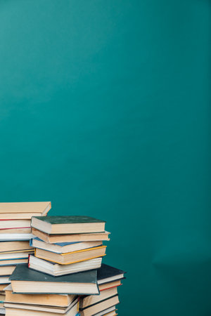 Stacks of books for teaching knowledge college library green backgroundの写真素材