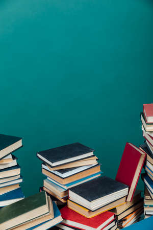 a lot of books to study in the university library on a green backgroundの写真素材