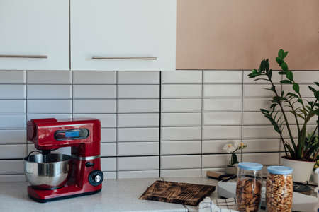 food processor, dishes and food on the table in the kitchenの写真素材