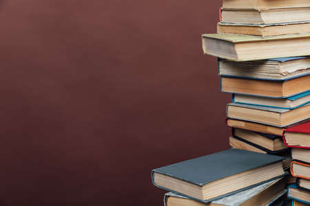 lots of books to study in the university library on a brown backgroundの写真素材