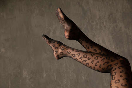 beautiful slender womens legs in black tightsの写真素材
