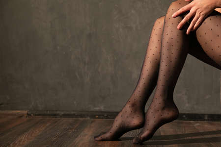 beautiful slender womens legs in black tightsの写真素材