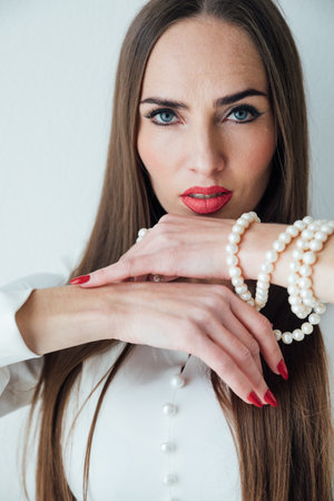 portrait of a beautiful woman in a white light dressの写真素材