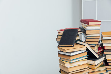 Stacks of books for teaching knowledge of the college school library white backgroundの写真素材
