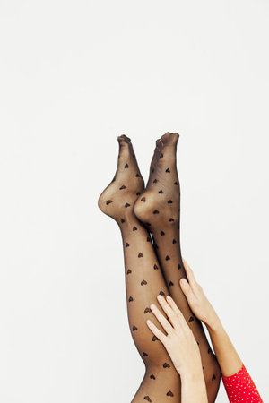 beautiful slender womens legs in black tights stockings