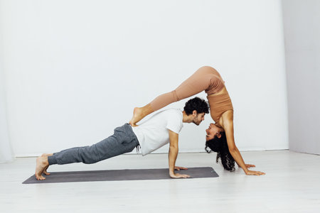 man and woman paired fitness yoga asana gymnastics