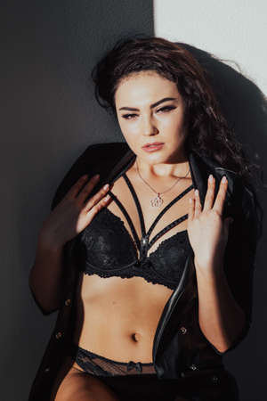 portrait beautiful woman brunette in lingerie homeの写真素材