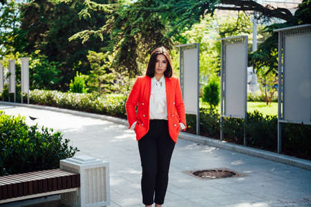 beautiful oriental business woman in a business suit at workの写真素材