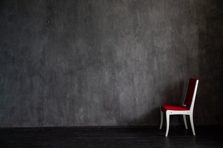 red chair in dark room interior furnitureの写真素材
