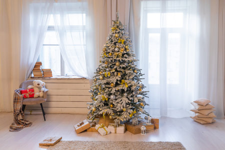 Christmas, New Year interior with red brick wall background, decorated fir tree with garlands and ballsの写真素材